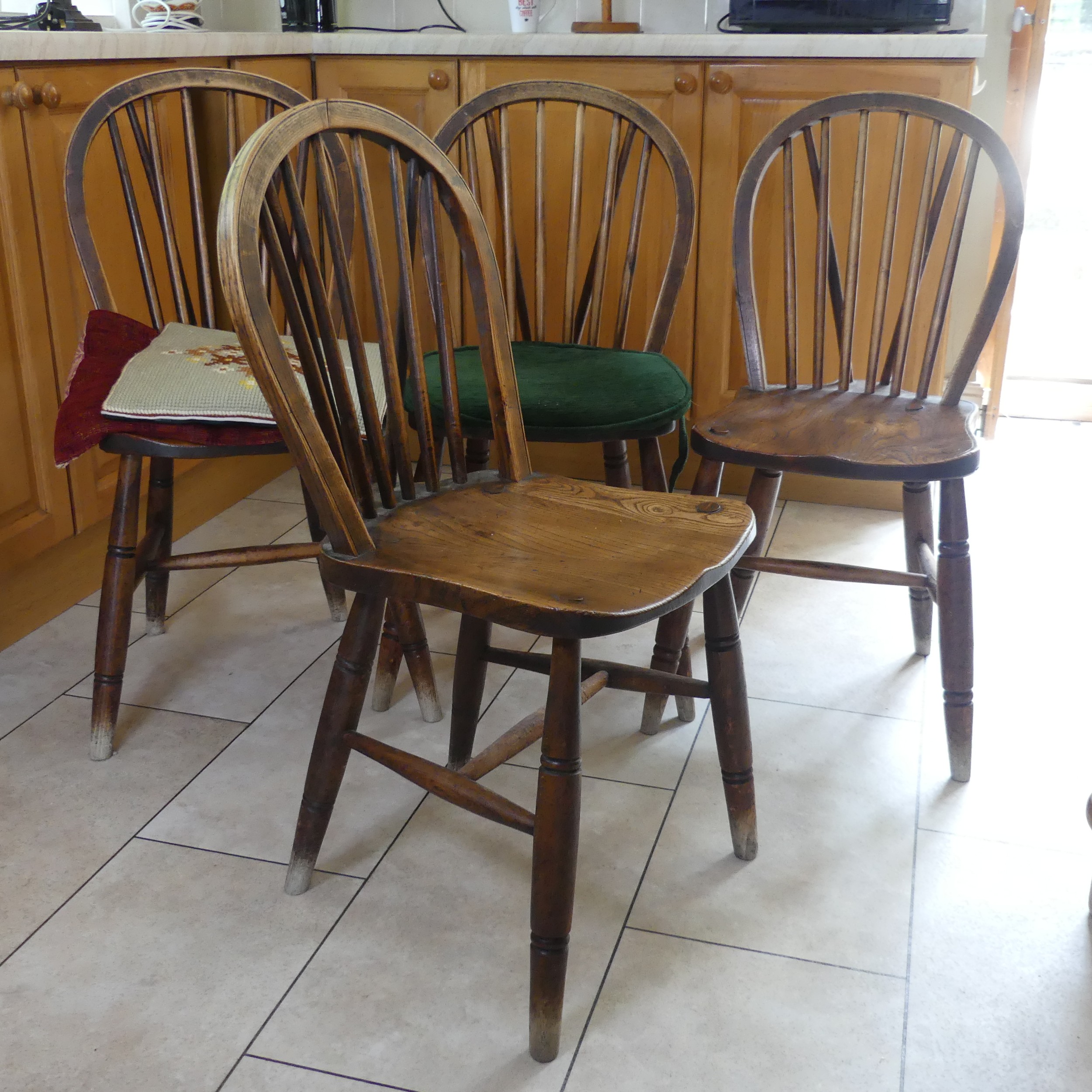 A set of four antique ash and elm kitchen Chairs, stick backs above moulded seats and raised on - Image 2 of 3