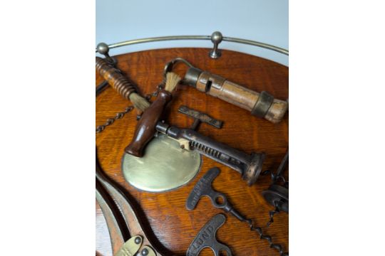 A 19th century two-pillar mechanical Corkscrew, with turned handle, together with an Edwardian Brass - Image 4 of 4