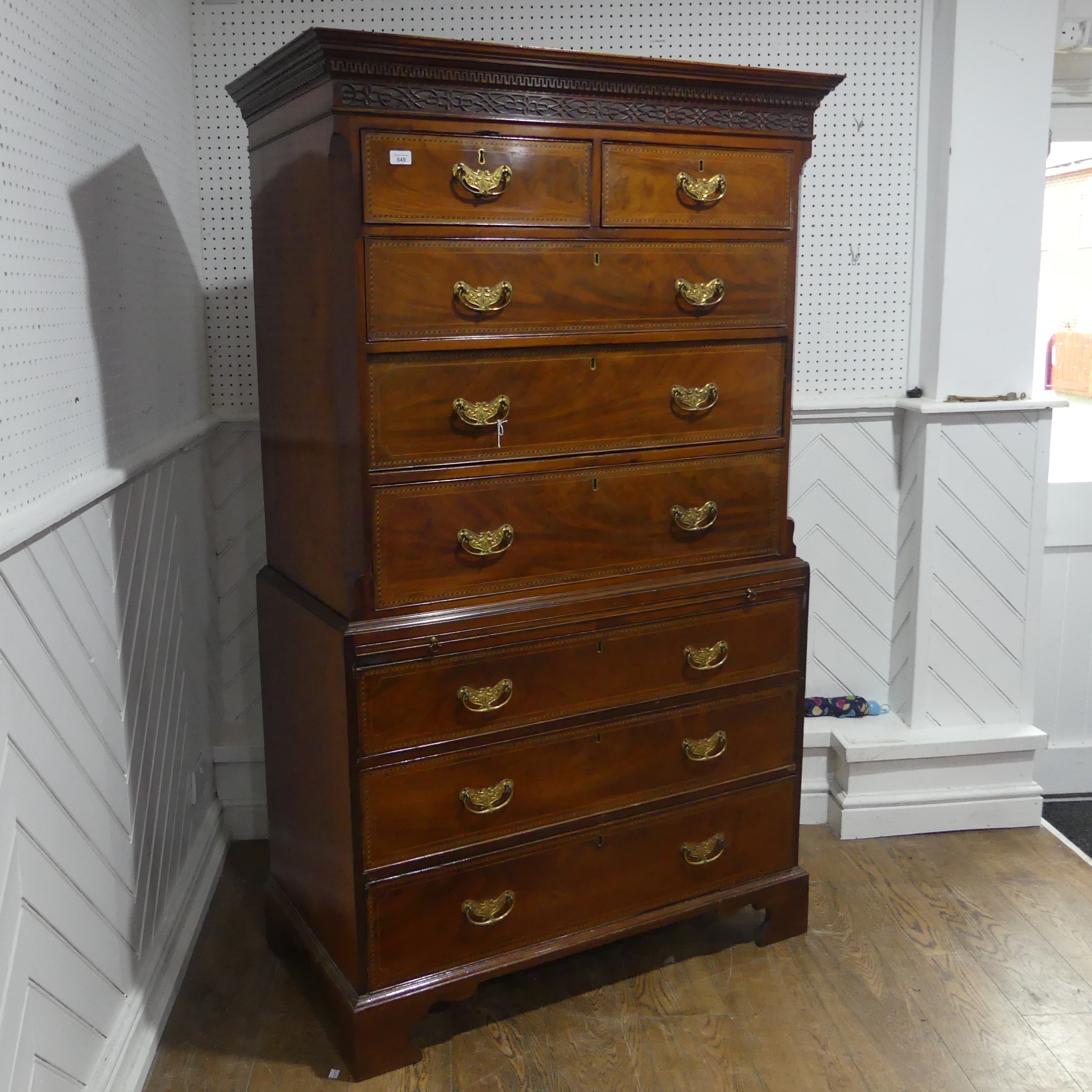 A Georgian mahogany Chest on Chest, the moulded and carved cornice over two short drawers and