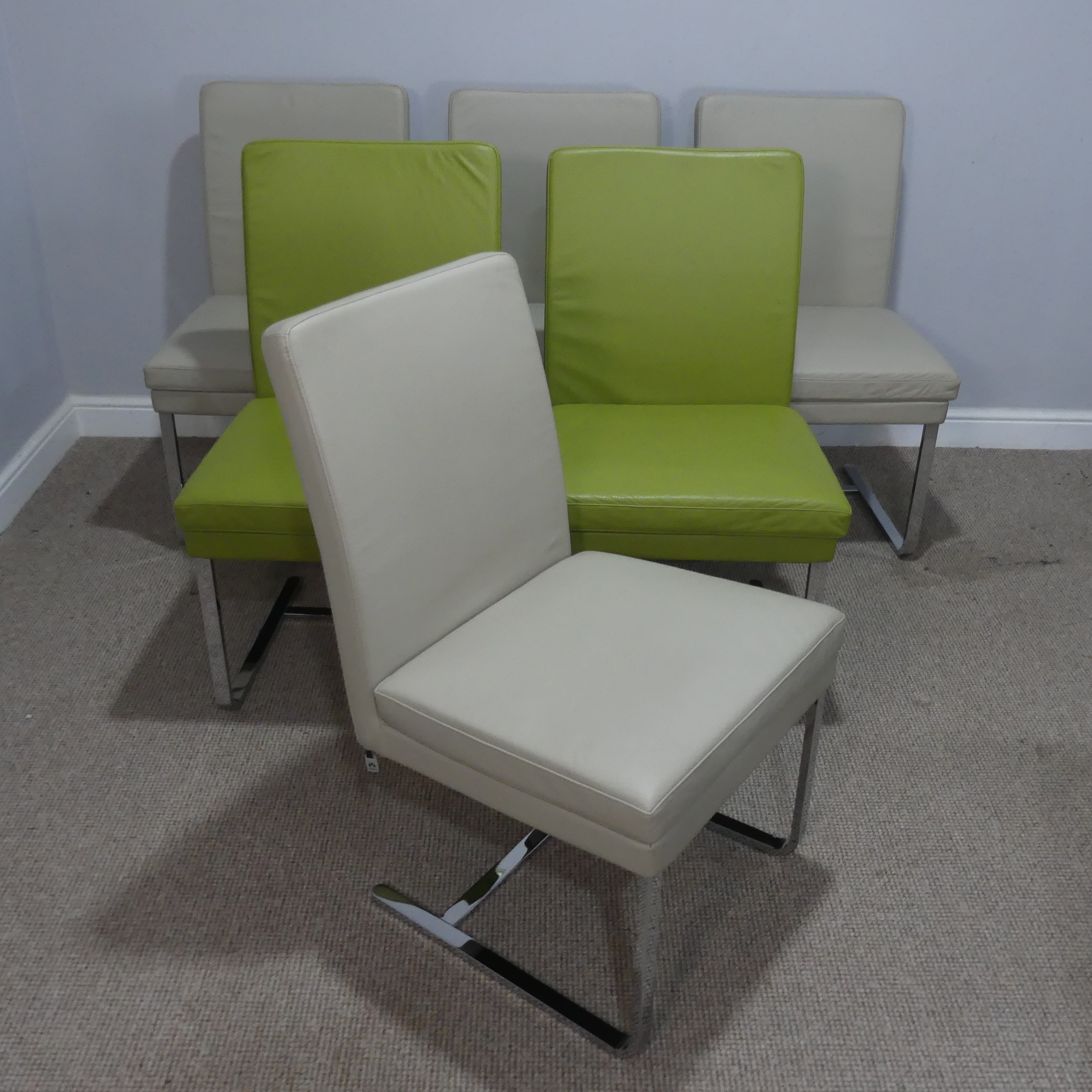 A set of six Hülsta Dining Chairs, chrome framed with leather upholstery, two green and four