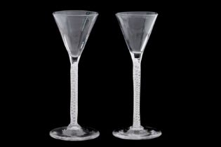 A PAIR OF 18TH CENTURY AIR TWIST WINE GLASSES