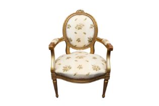 A LOUIS XVI STYLE GILTWOOD FAUTEUIL ARMCHAIR