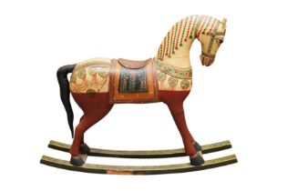 AN INDIAN PAINTED WOOD ROCKING HORSE OF SMALL PROPORTIONS, 20TH CENTURY