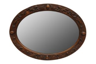 A FRUITWOOD OVAL MIRROR