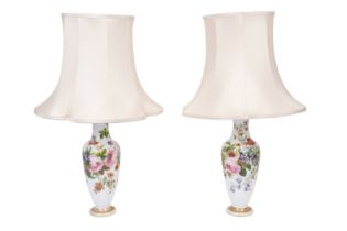 A PAIR OF 19TH CENTURY HAND PAINTED MILK GLASS TABLE LAMPS