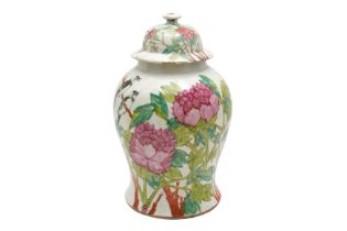 A CHINESE FAMILLE-ROSE 'FLOWERS AND MAGPIES' VASE AND COVER