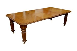 A VICTORIAN MAHOGANY EXTENDING DINING TABLE