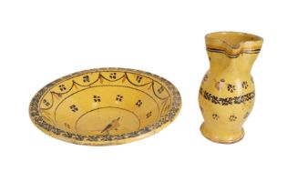 A 19TH-CENTURY CONTINENTAL YELLOW GLAZED POTTERY JUG AND BASIN