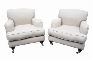 H J COOPER LTD OF PUTNEY; A PAIR OF CONTEMPORARY HOWARD STYLE ARMCHAIRS