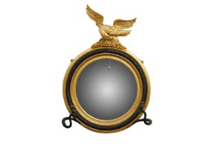 A REGENCY PERIOD CONVEX GILTWOOD MIRROR, CIRCA 1810