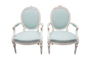 A PAIR OF FRENCH LOUIS XVI STYLE WHITE PAINTED FAUTEUIL ARMCHAIRS