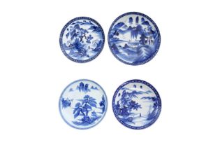 A GROUP OF FOUR CHINESE BLUE AND WHITE CHARGERS