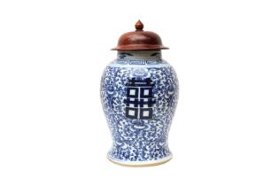 A CHINESE BLUE AND WHITE 'SHUANGXI' VASE 清十九世紀 青花囍紋罐