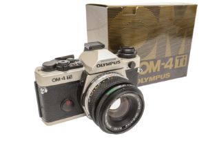 A Boxed Olympus OM4Ti with 50mm f1.8.