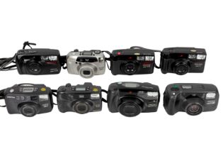 Eight Pentax point and shoot cameras.