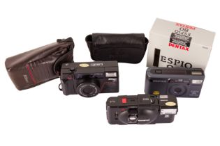 Three Compact Point-and-Shoot Cameras.