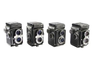 Four Yashica TLR Cameras.