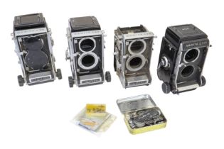 Four Mamiya TLR bodies for parts.