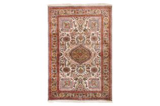 AN EXTREMELY FINE SIGNED SILK QUM RUG, CENTRAL PERSIA