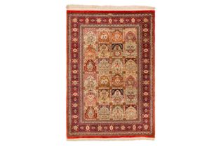 AN EXTREMELY FINE SIGNED SILK QUM RUG, CENTRAL PERSIA