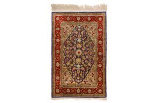 AN EXTREMELY FINE SIGNED SILK HEREKE RUG, TURKEY