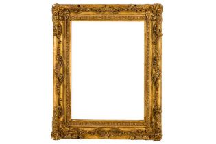 A LOUIS XIV CARVED, COMPOSTION AND GILDED FRAME