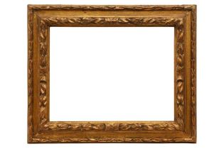 A BOLOGNESE 17TH CENTURY STYLE CARVED AND GILDED FRAME