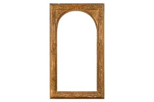 A FRENCH LE BRUN 19TH CENTURY CARVED AND GILDED FRAME, SEGMENTED WITH LEAF AND FLOWER HEADS