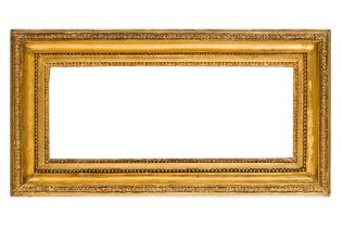 A 19TH CENTURY CARLO MARATTA CARVED AND GILDED FRAME