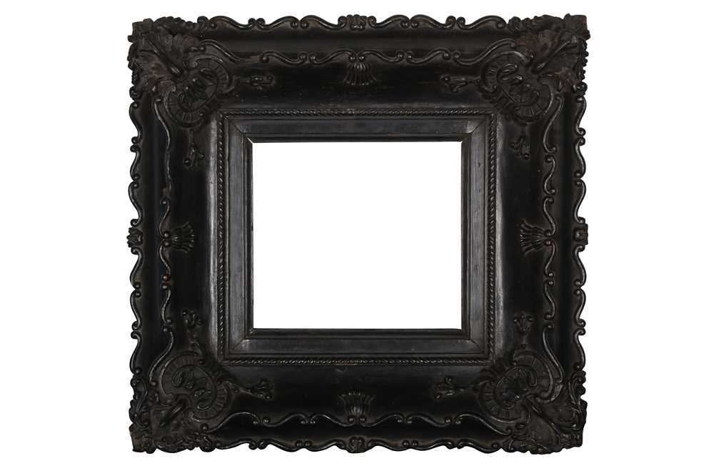 AN 18TH CENTURY CHINA TRADE, LOUIS XV STYLE EBONY AND CARVED WOOD FRAME