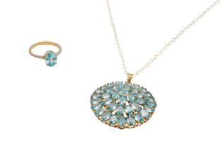 A 9CT GOLD BLUE ZIRCON PENDANT NECKLACE AND A RING