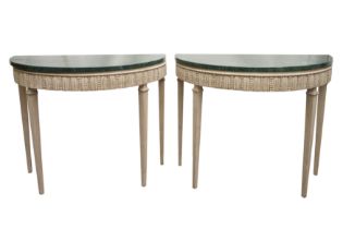 A PAIR OF ITALIAN STYLE PAINTED DEMI LUNE CONSOLE TABLES