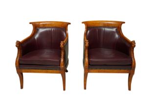 A PAIR OF EMPIRE STYLE FIGURED BEECH LIBRARY ARMCHAIRS