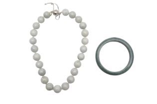 A GUATEMALAN JADEITE BANGLE AND A JADE BEAD NECKLACE