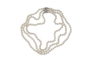 A THREE-STRAND PEARL NECKLACE WITH A DIAMOND CLASP