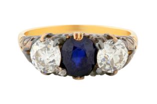 A SAPPHIRE AND DIAMOND THREE-STONE RING