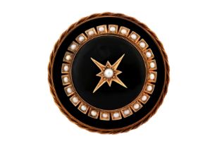 AN ONYX AND SEED PEARL MOURNING BROOCH