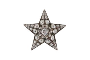 A DIAMOND STAR BROOCH