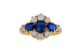 A SAPPHIRE AND DIAMOND CLUSTER RING