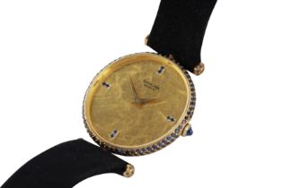 SARCAR. A GOLD AND SAPPHIRE WRISTWATCH
