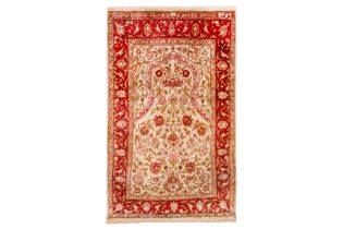 AN EXTREMELY FINE SIGNED SILK HEREKE PRAYER RUG, TURKEY