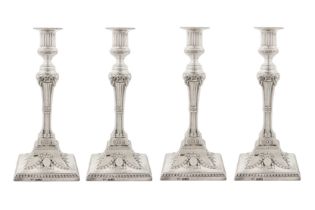 A set of four George III sterling silver candlesticks, Sheffield overstruck for London 1774 by John