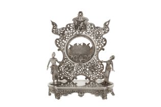 An unusual late 19th / early 20th century Burmese unmarked silver watch stand holder, Rangoon circa