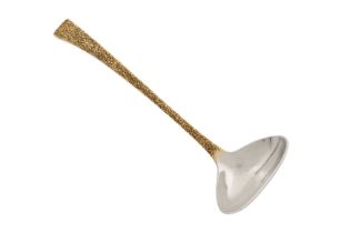 An Elizabeth II modernist parcel gilt sterling silver soup ladle, London 1976 by Stuart Devlin (1931