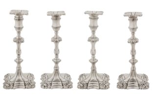 A set of four George II sterling silver candlesticks, London 1755 by John Cafe