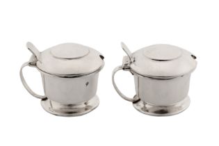 A pair of George V ' Arts and Crafts' mustard pots, Birmingham 1914 by Liberty and Co