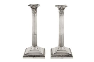 A pair of Edwardian sterling silver candlesticks, London 1903 by William Hutton and Sons