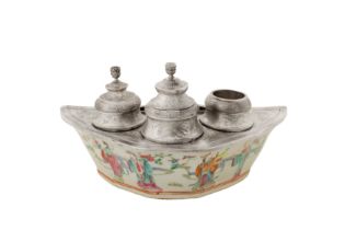 A late 19th century silver ink well, upon a Chinese porcelain dish