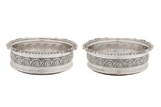 A pair of George III sterling silver wine coasters, London 1812 by Solomon Hougham