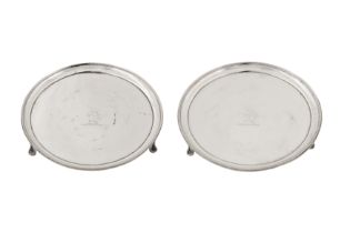 A pair of George III sterling silver waiters, London 1785 by Thomas Chawner